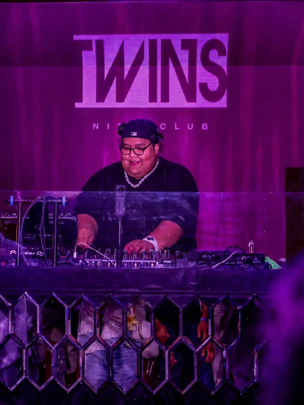 DJ performing beneath the TWINS wordmark